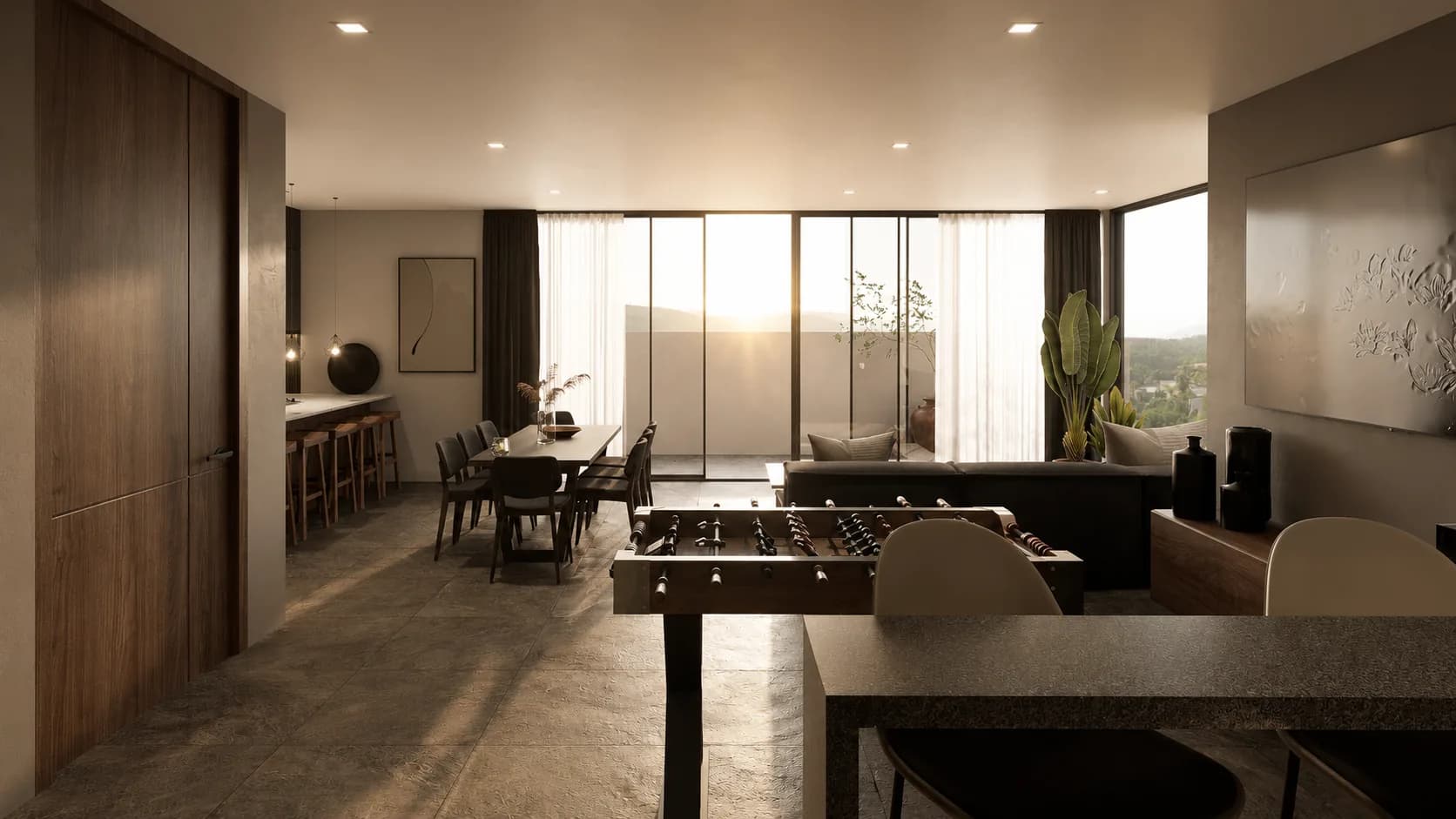 Estancia del penthouse de Bosques, con comedor, futbolito y ventanales al atardecer