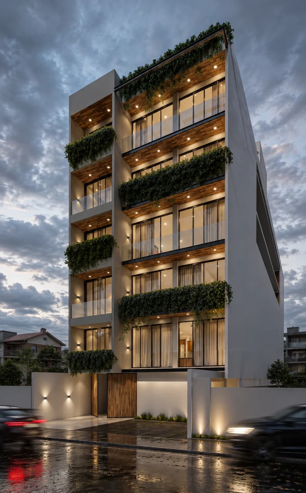 Fachada de Campestre al anochecer, con jardineras de vegetación en cada terraza